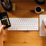 Closeup shot of an entrepreneur working from home and doing calculations